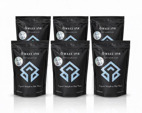 Waxx Inn Curaçao Expert Stripless Hot Wax Beads 1kg pack of 6 – six black pouches with Curaçao holographic label staged on white background, professional stripless film hot wax made in Italy