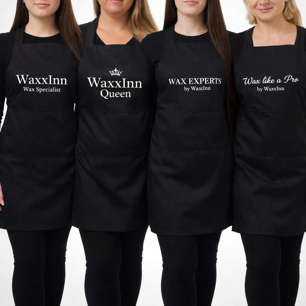 Four people wearing black aprons with WaxxInn branding on a white background