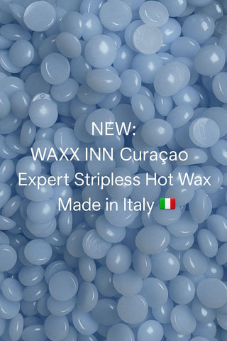 Blue wax beads with text about WAXX INN Curaçao hot wax, made in Italy.