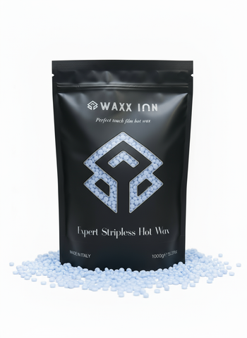 Waxx Inn Curaçao Expert Stripless Hot Wax Beads 1kg – black pouch with light blue hard wax beads scattered around, made in Italy, professional depilatory wax 1000g