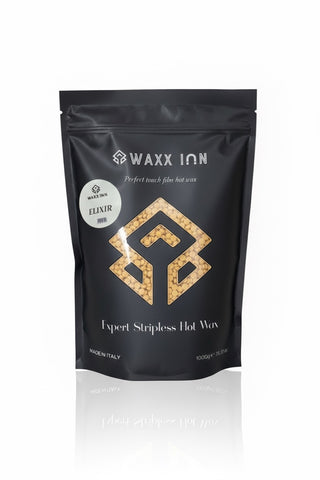Waxx Inn Elixir Expert Stripless Hot Wax Beads 1kg – black pouch with golden Elixir label and warm gold wax beads, stripless hard wax for all hair types, professional formula made in Italy