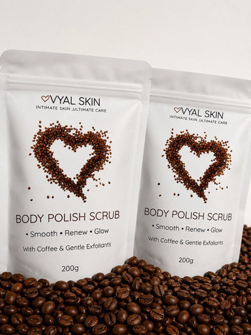 Two VYAL SKIN Coffee Body Polish Scrub 200g pouches on a bed of coffee beans – body polish scrub that smooths, renews and adds glow to all skin types